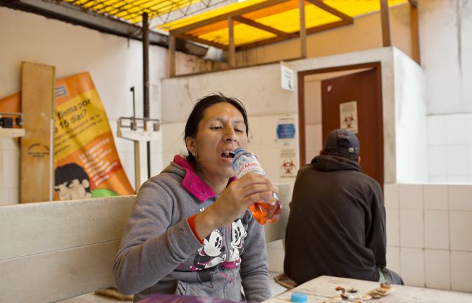 Tamara takes her daily dosage of Tuberculosis medication at a clinic in downtown Lima, Peru. Though Tuberculosis medication is free in Peru, patients are not allowed to take their medication at home. Thus, people have to go to the clinic every day, which