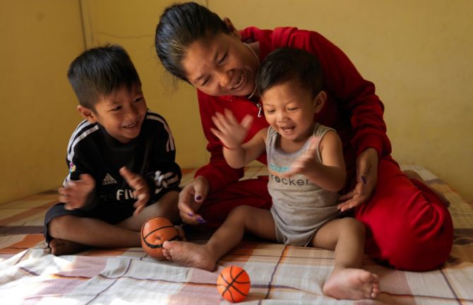 Sopheap likes to play with her sons in the morning. Like other mothers working the night shift, she enjoys being able to spend her days in quality time with her children.