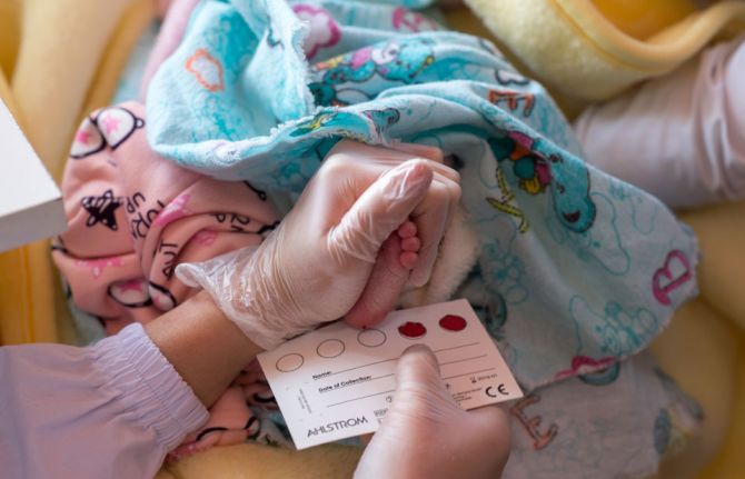 Collection of a one week old baby's blood drop for subsequent instant analysis on HIV. OSH, Kyrgyzstan, Nov 2017