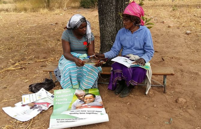 Apostolic community volunteer providing one-on-one counselling session for one of the church members in Gokwe North. Photo Credit: World Vision Health Kiosk staff.