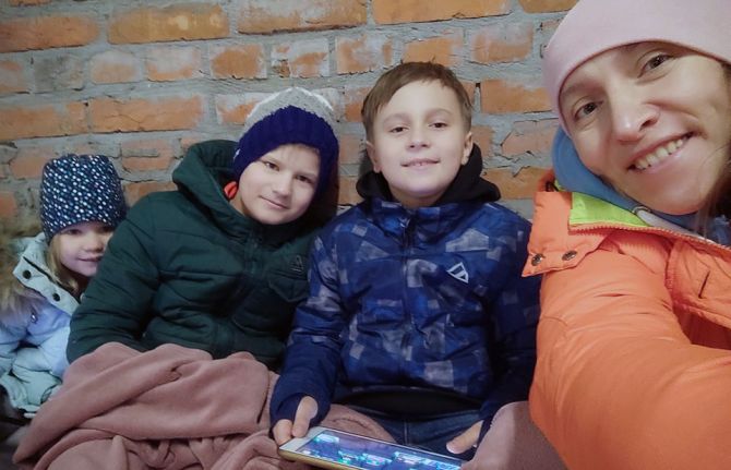 Valeriia Rachinska with her extended family in a bomb shelter in Kyiv on February 24 before she fled the city.