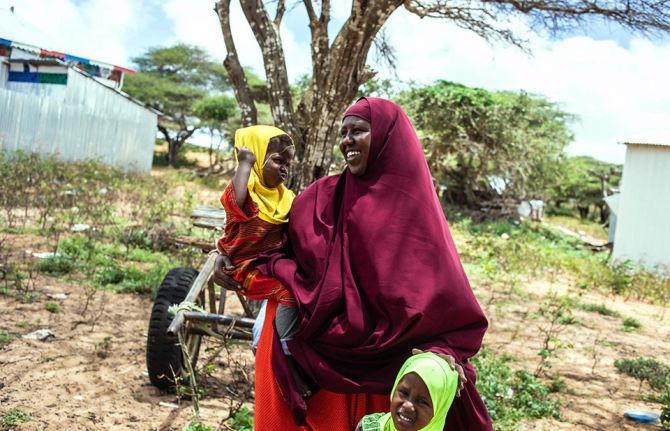 A mother and her children at an integrated measles, polio, vitamin A and deworming campaign held from August to September 2020. Photo credit: WHO Somalia