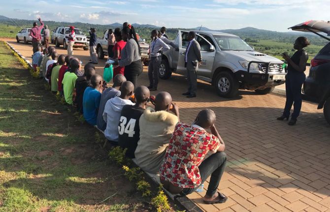 HPRAF team handing out food and drink to 19 of the young people on their release from prison. Photo courtesy of HRAPF.