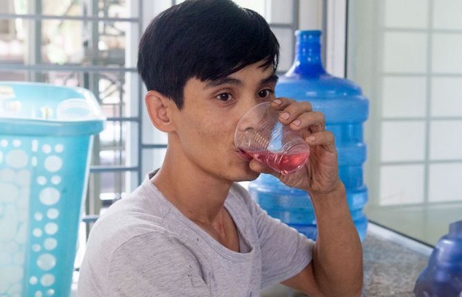 Opioid substitution therapy patient takes methadone at the District Heath Centre of South Tu Liem, Hanoi, Viet Nam. Credit: UNAIDS.