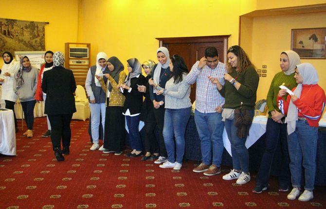 Youth participate in an exercise which shows the damaging impact of stigma and discrimination in the community.