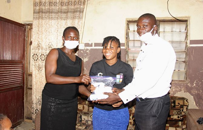 From left, standing, Queen Kennedy, community pharmacist; Job Ogodo and Gloria Ogodo.  Photo taken in Maararaba, Nasarawa State, North Central Nigeria, June 2020. Photo courtesy of ICW WA.