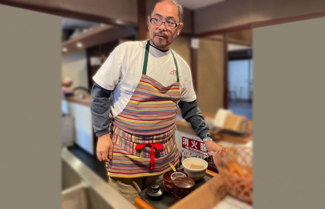 Kennosuke Okumara, head of the Kanazawa centre’s secretariat, serving tea and coffee in the open bar kitchen to visitors.