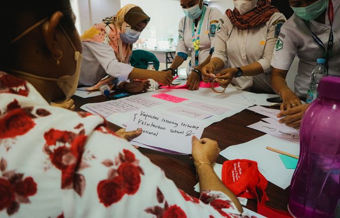 Health-care workers in Sentani, West Papua, discuss the sexual and gender diversity of young key populations.