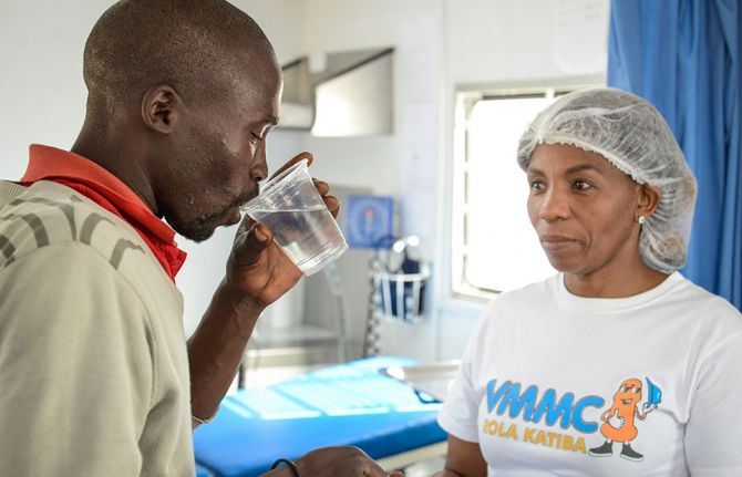 Mmote Mohasi, a voluntary medical male circumcision client, receives pain medication at a mobile clinic in a remote area outside Braakfontein, Lesotho, after he undergoes voluntary medical male circumcision. 31 October 2019