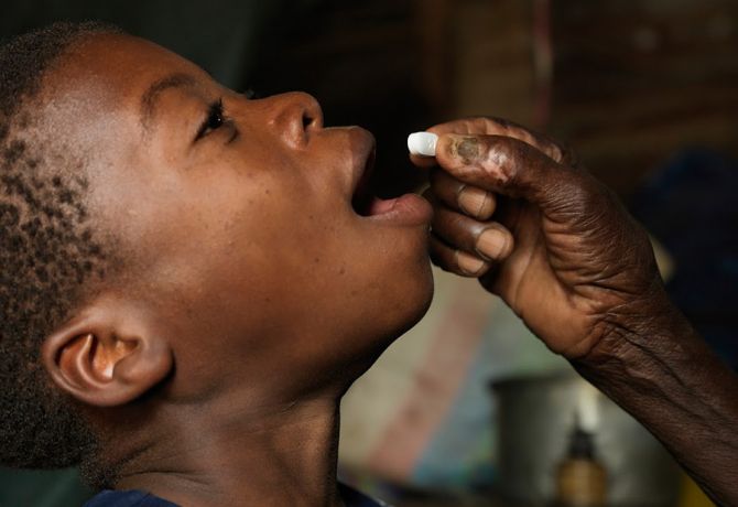 Henriques having his ARVs administered at home by his grandmother. Peter Caton/UNAids  Flooding in Beira, Mozambique.